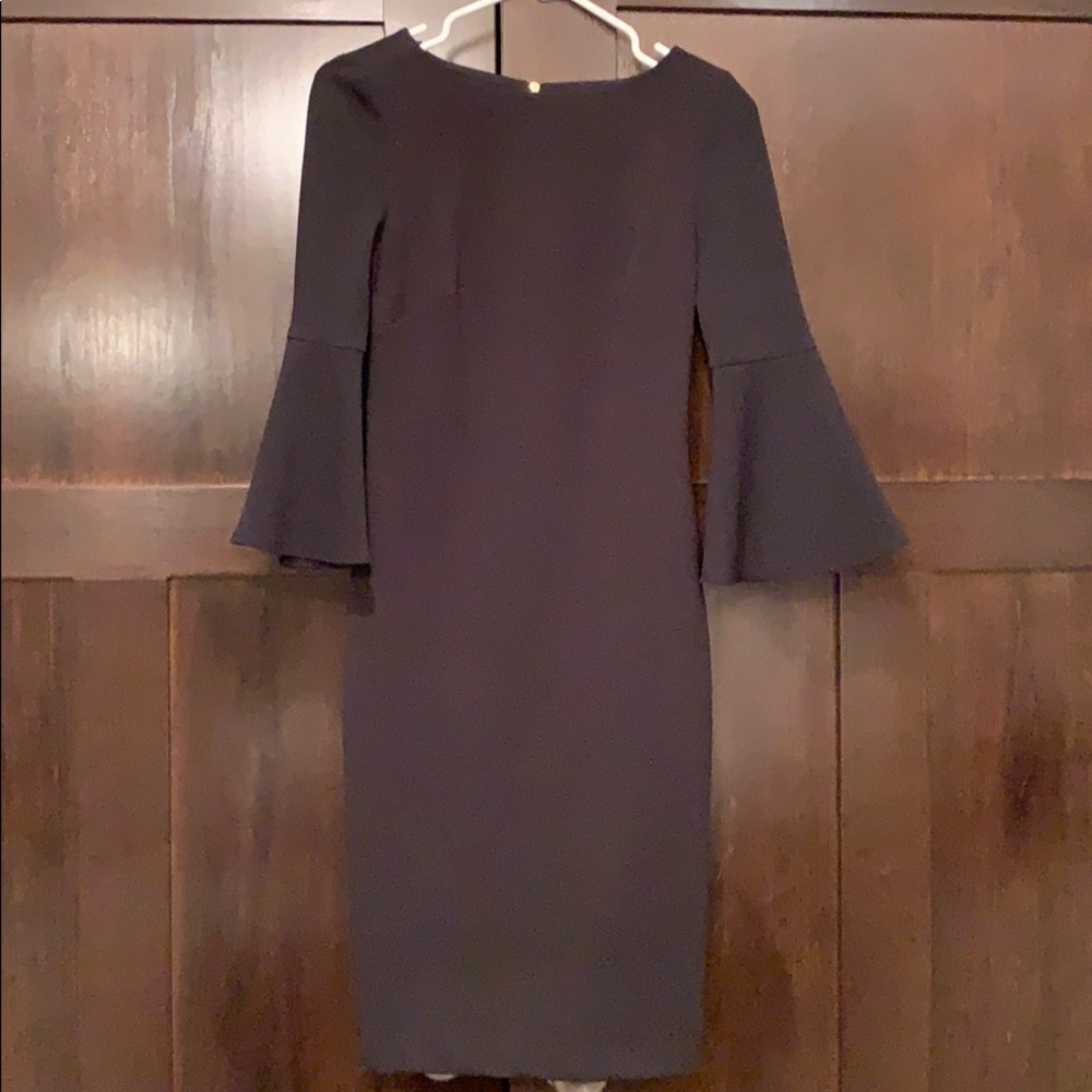 Mid length black dress with bell sleeves